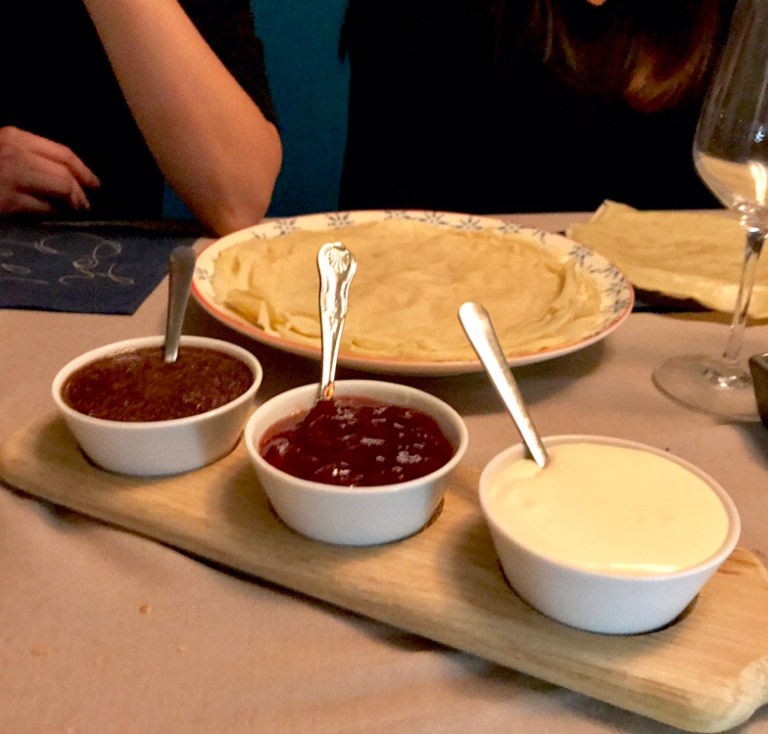 Homemade nutella, jam and cream on crepes