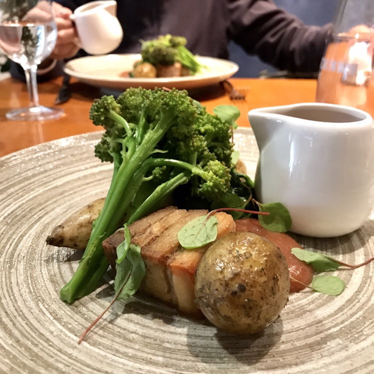 KELMSCOTT PORK BELLY & FILLET Jersey royals & purple sprouting broccoli. Spiced rhubarb.