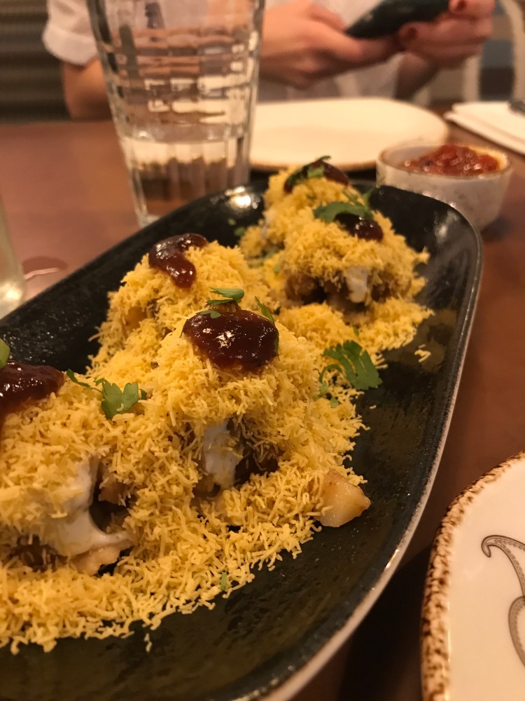 Papri Chaat [vegetarian] spiced potatoes and black chickpeas on a wheat cracker with tamarind chutney