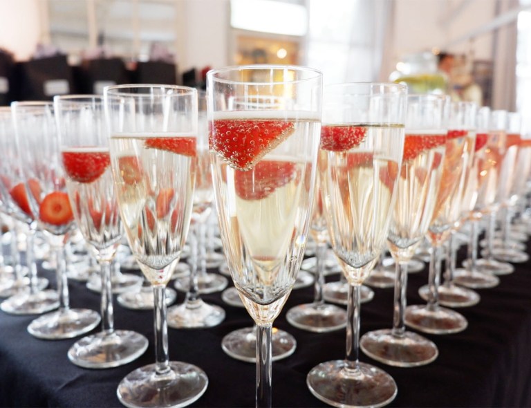 Dozens of glasses full of Prosecco