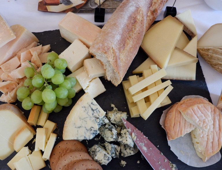 A flat lay of many different cheeses