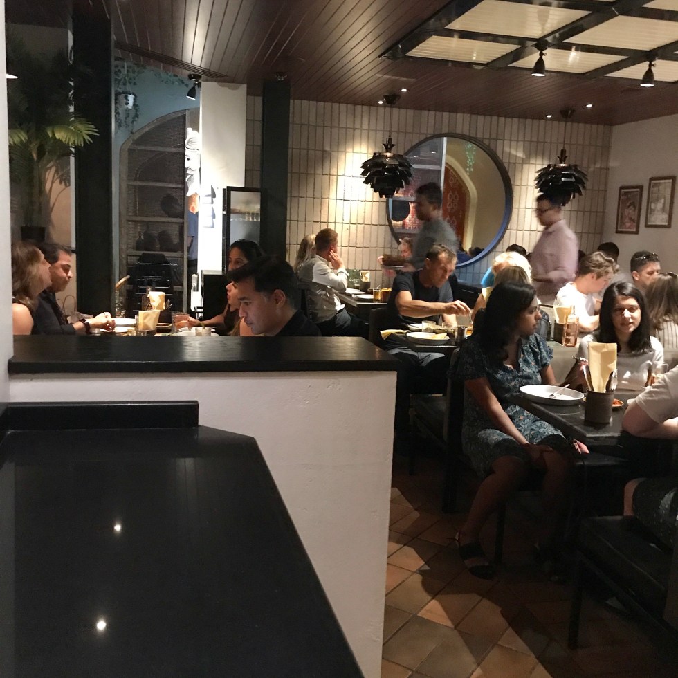 Downstairs in Hoppers Marylebone, packed full of customers