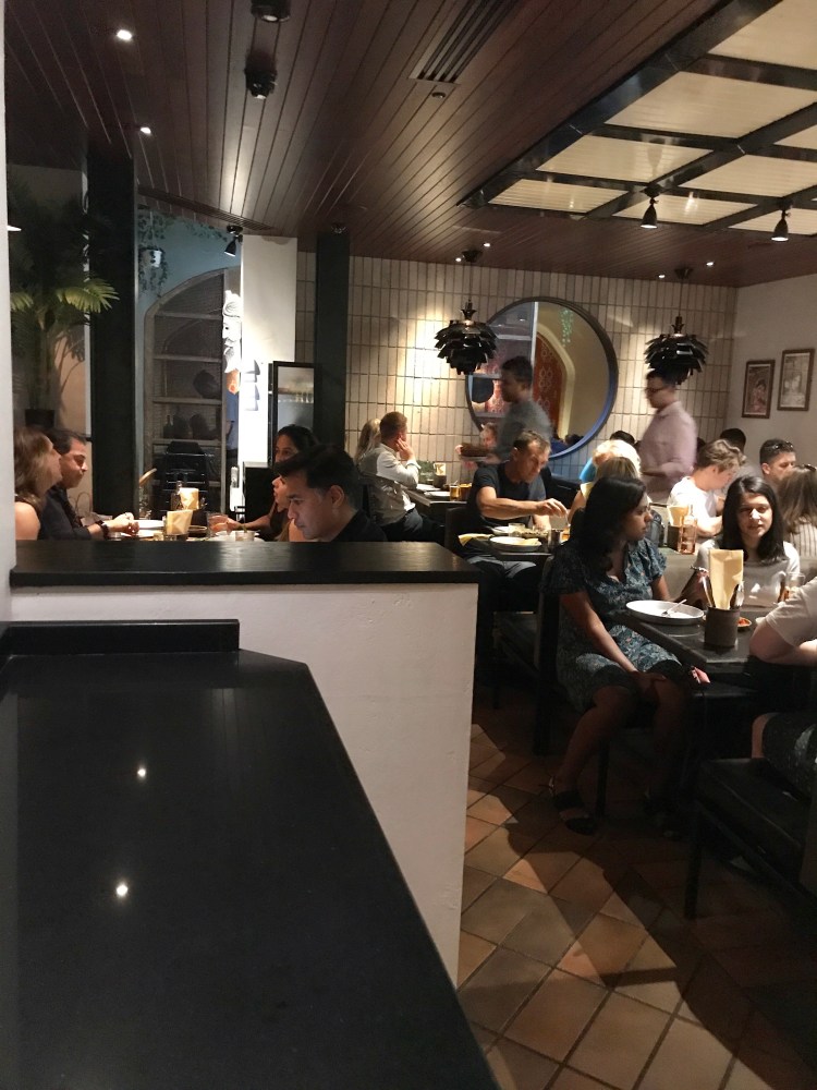 Downstairs in Hoppers Marylebone, packed full of customers