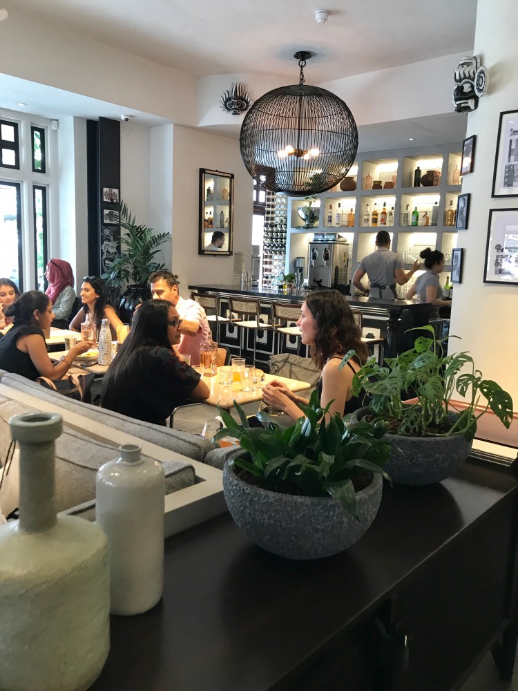 Customers chattering away in a busy restaurant