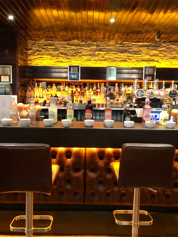 In a uniform line of mixers with the correct garnishing in front of them