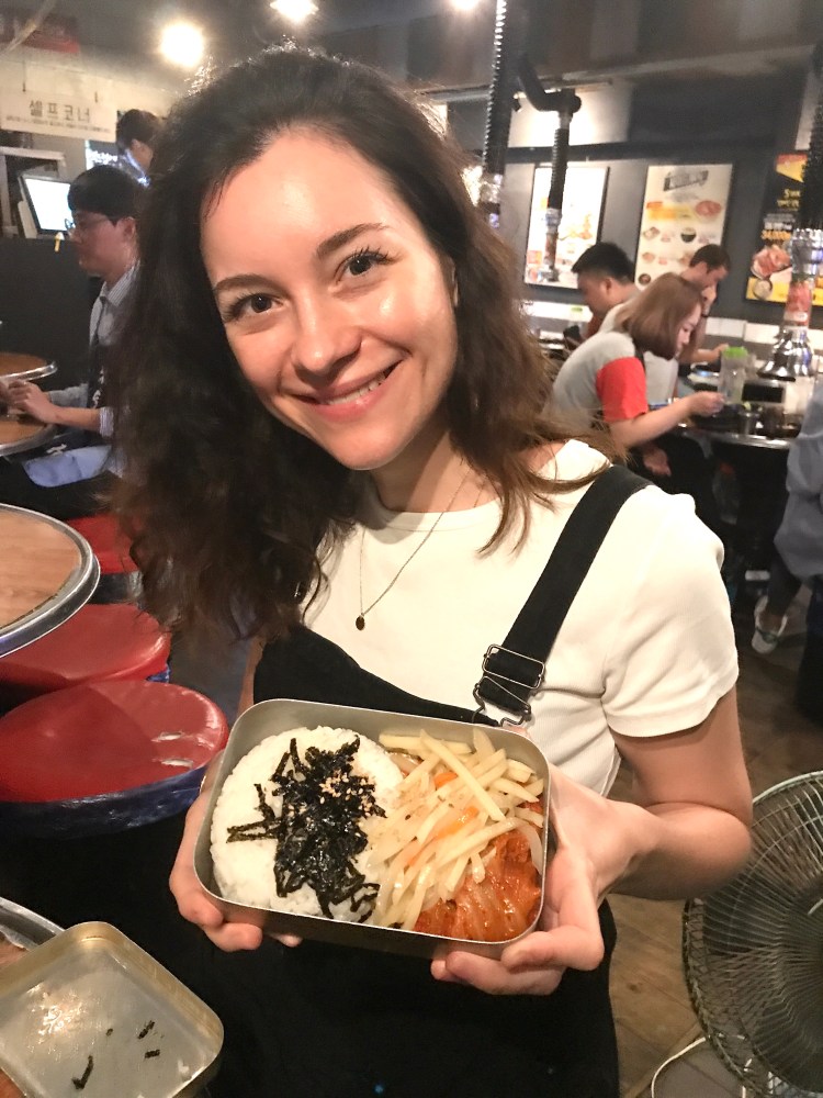 Claire showing her tinned box of food