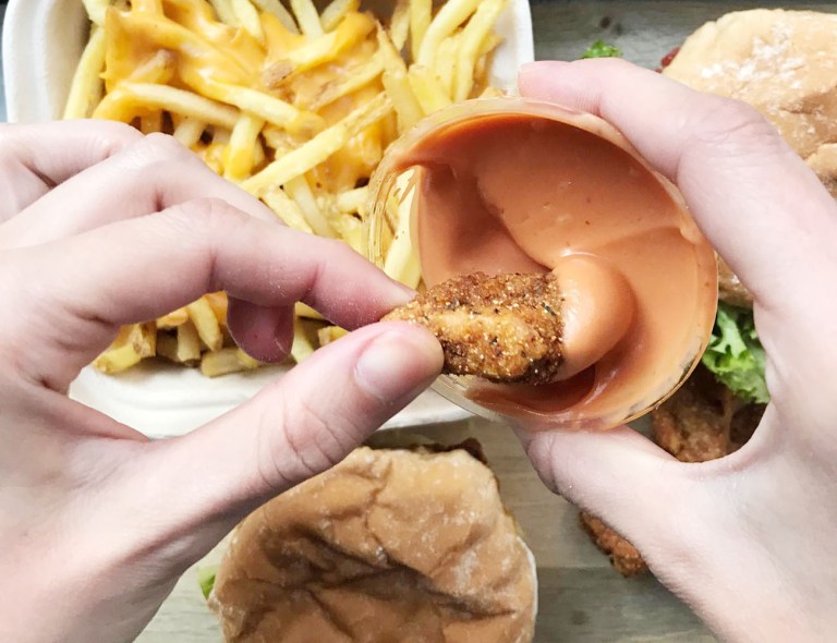 Vegan Nuggets dipped into their Neat sauce