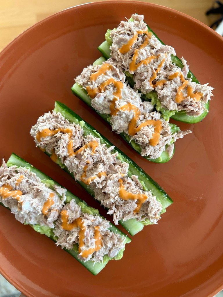 Rice, Avo, Tuna mayo, in cucumber drizzled with sriracha mayo