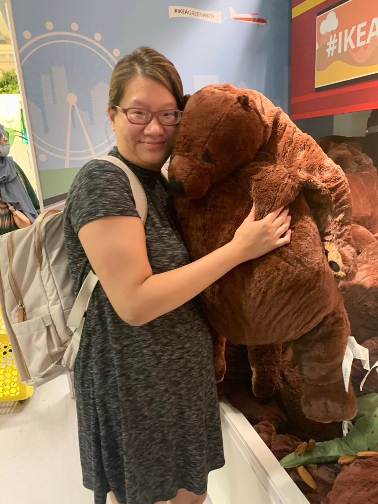 Holding a plush bear for dear life