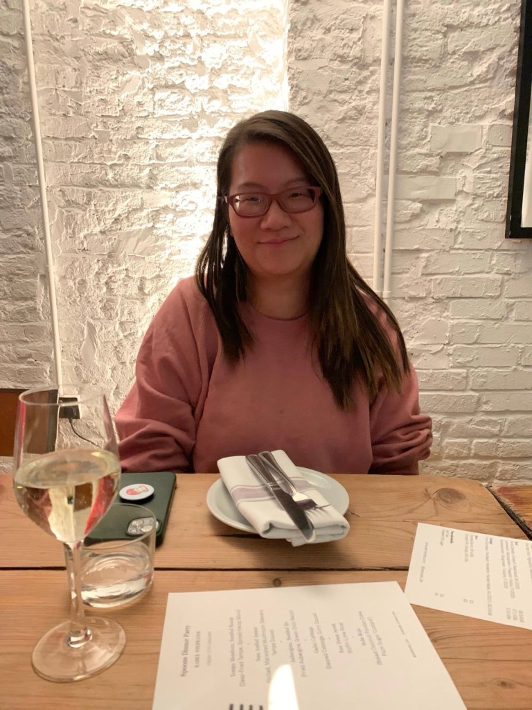 Wearing a pink jumper smiling away at the camera